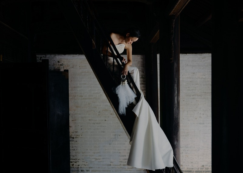 Bride on a dark staircase